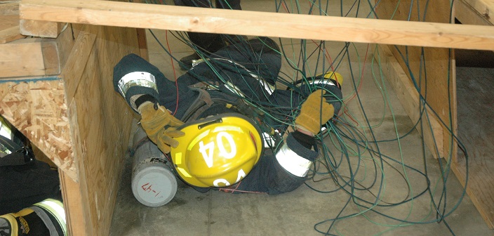 Firefighter training includes learning how to navigate confined spaces in full gear (Photo: HLOB Fire Department)