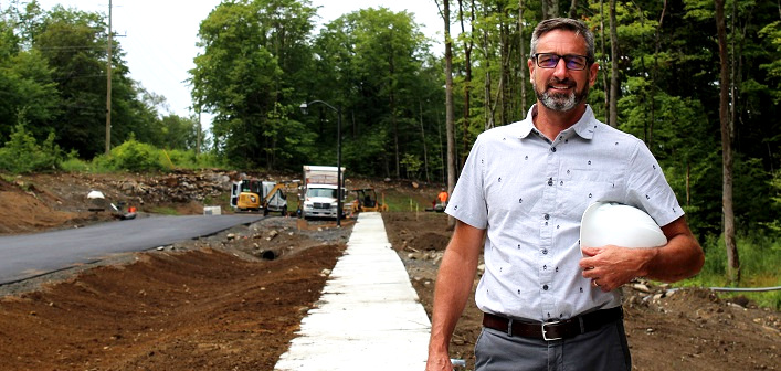 Greystone owner and president, Pat Dubé, at the new entrance road to Campus Trails and the future Fairvern site