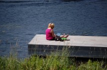 Naomi Mesbur enjoys writing on the dock.