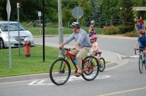 Mayor Aitchison joined the kids' ride in business attire to promote cycling to work