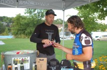 Brent Ellerson serves Totem Juice samples at the Mayor's Bike Ride