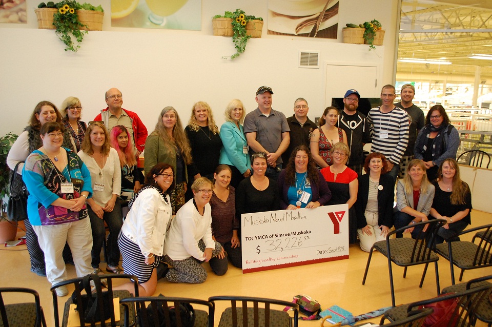 Muskoka Novel Marathon writers with a cheque for YMCA Literacy Services