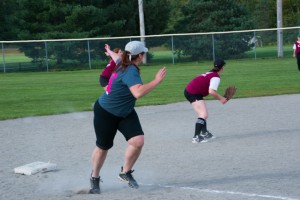 A member of the Twits breaks for home to score a run after an outfield hit on Saturday