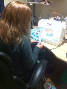 Lillian Bowman, 13, sews a landscape quilt