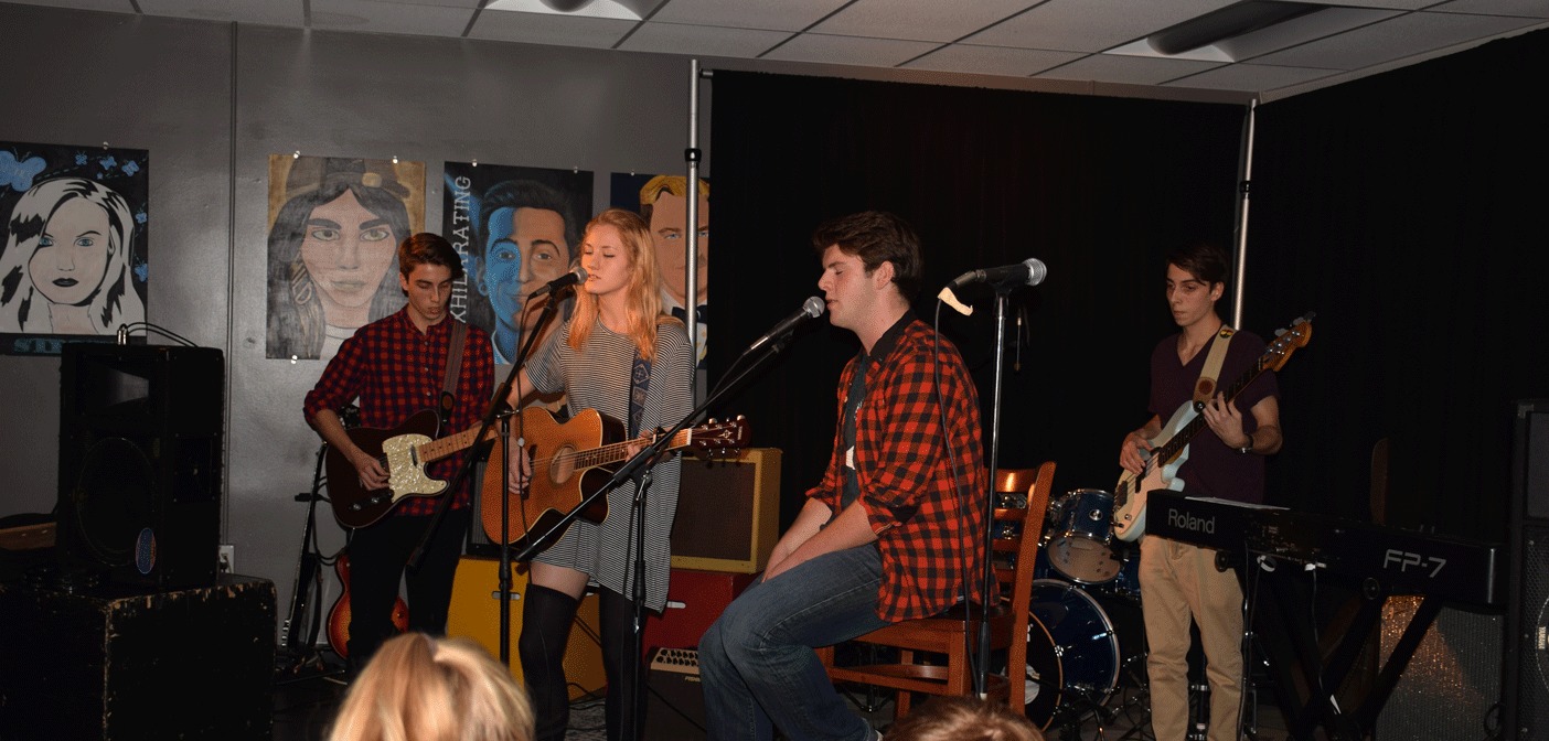 From left, Jesse Jodouin, Hannah Bryon-de la Vega, Chris Pearse and Cole Jodouin rock the stage at Caf Jam