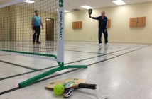 Dennis Wilks, right, shows Ben Robitaille the Pickleball basics
