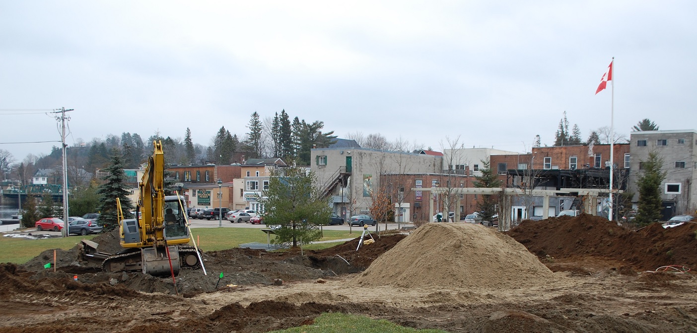Crews have begun digging the foundation for a permanent bandshell in River Mill Park