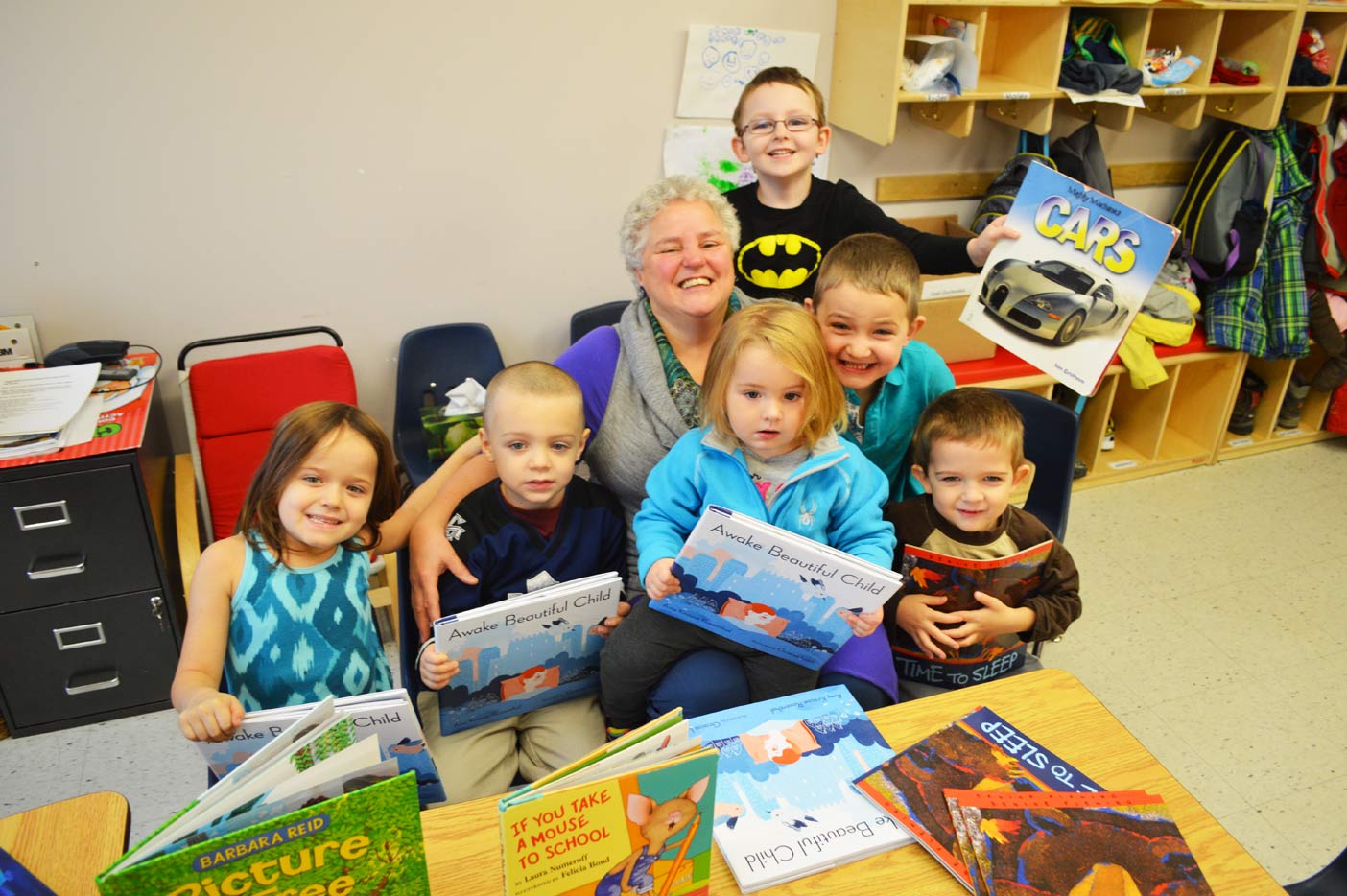 The kids at a local Montessori School are always happy to see Sandy Inkster, especially when she comes to read. They each received a free book from Inkster on Tuesday. 