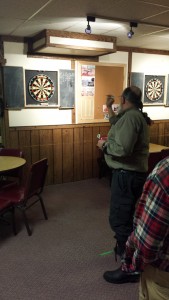 Jon Romanow concentrates on the bullseye as he tries to close out a victory