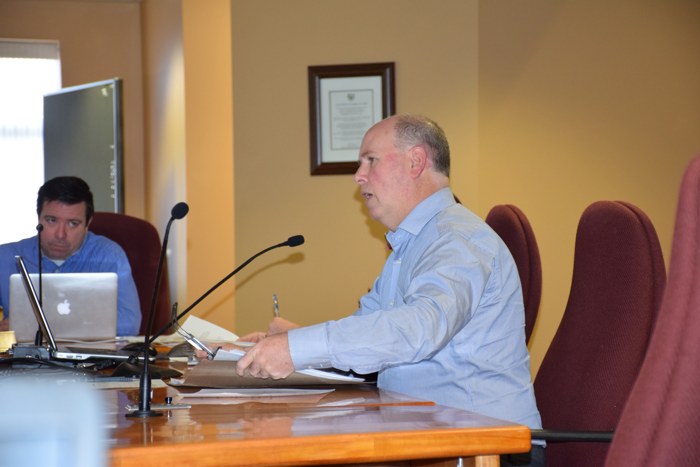 John Gallagher speaks to the Town's Planning Committee on January 13 as Huntsville Councillor Bob Stone looks on. 