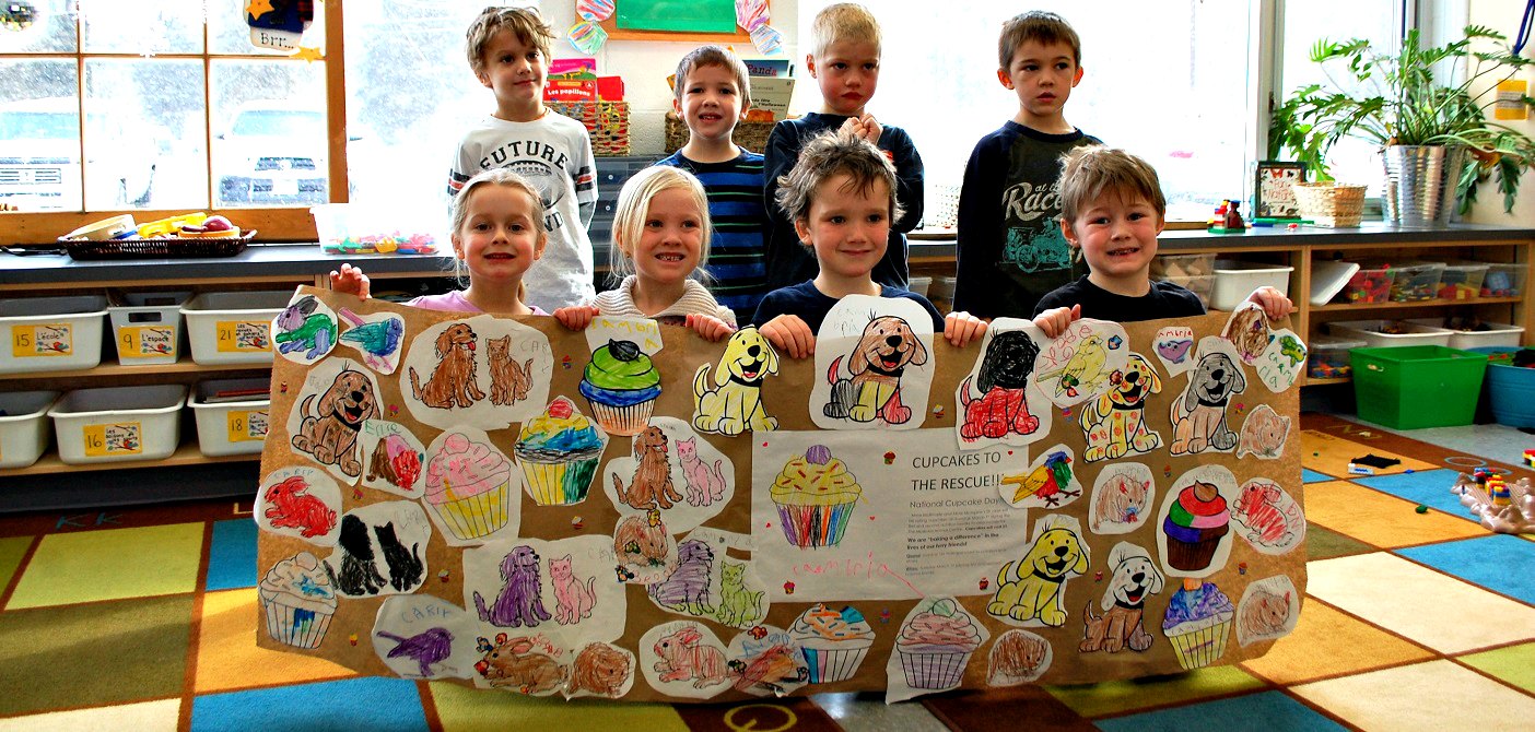 Some of Riverside’s SK students with the banner they made