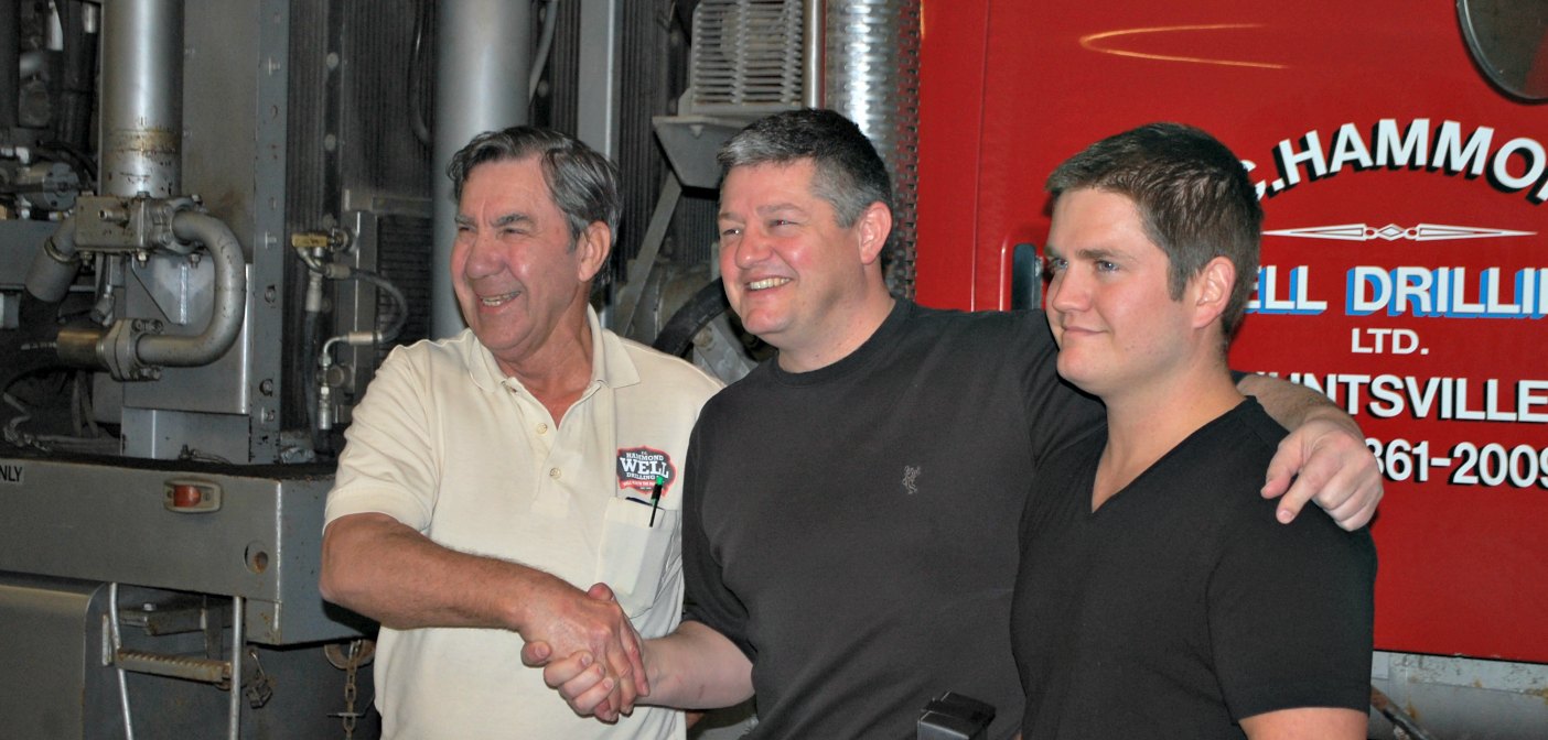 Mayor Scott Aitchison with owner Norm Yearley, left, and Mike Murray after drawing the lucky winner