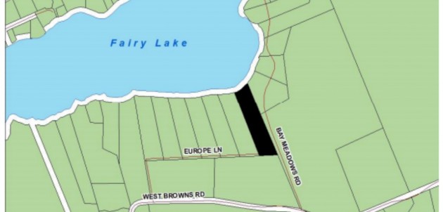 Council meeting short with four councillors absent; large boathouse receives approval