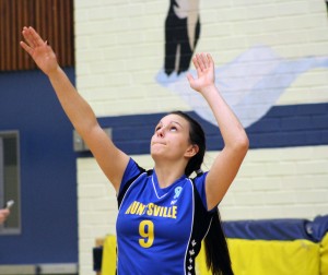 Phylicia Earl prepares to serve during a game held on home turf in the HHS gymnasium