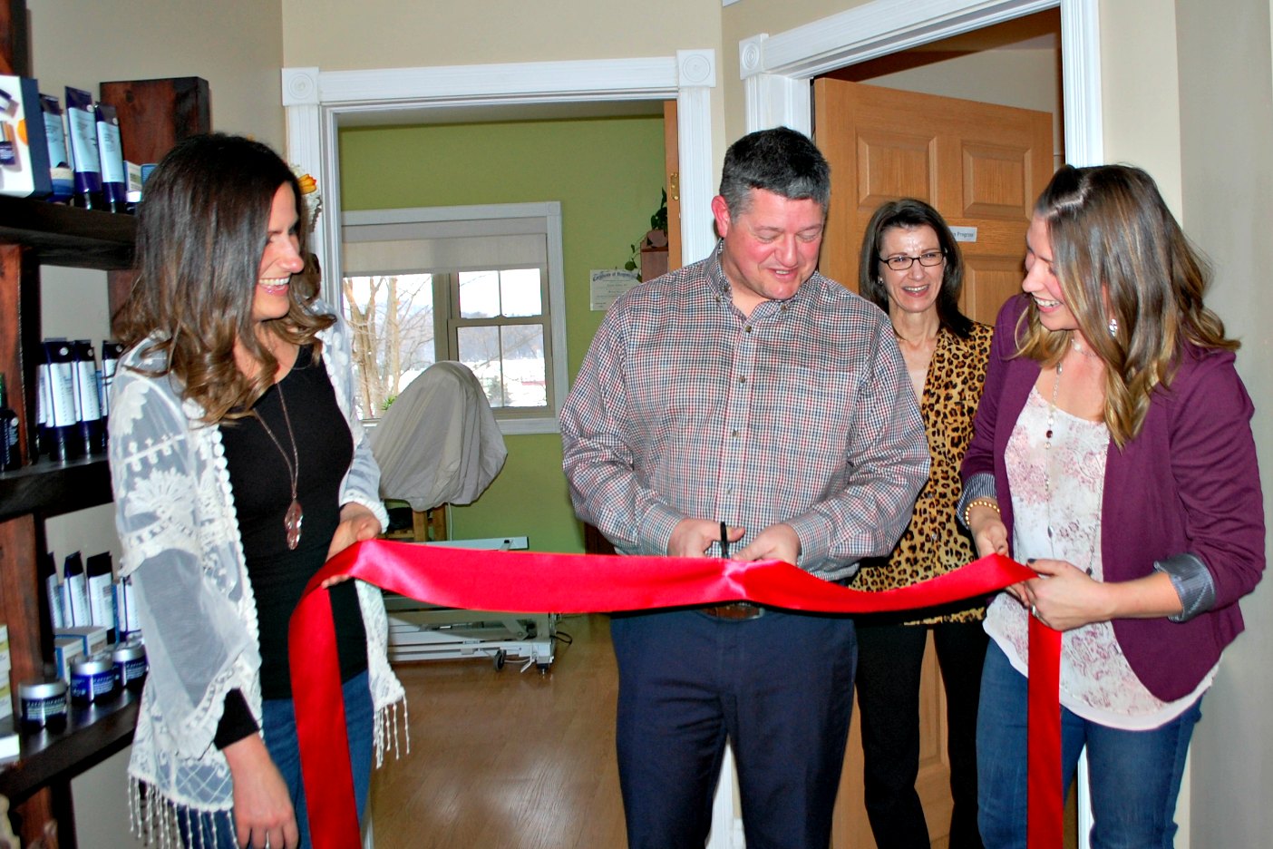 (From left) Angela Urquhart, Mayor Scott Aitchison, esthetician Gwynneth Moore and owner Kristin Adams celebrate the launch of Spa Works with an official ribbon cutting