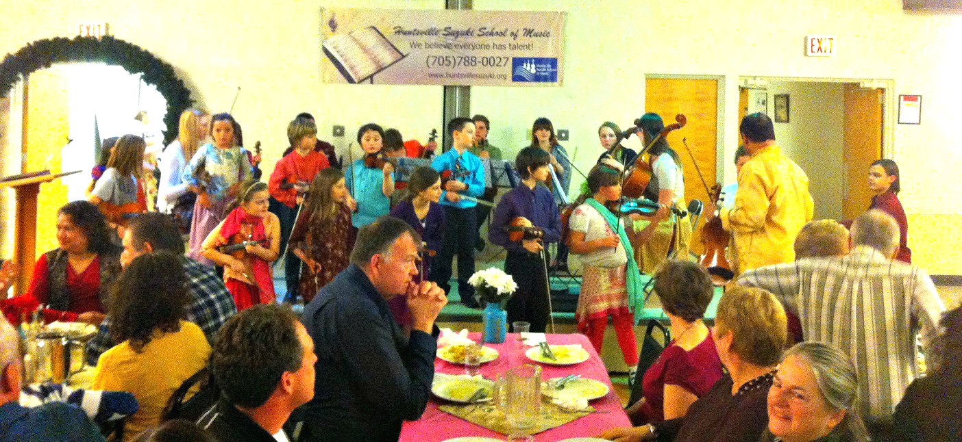Suzuki students play for guests at the school’s 2015 East Indian banquet