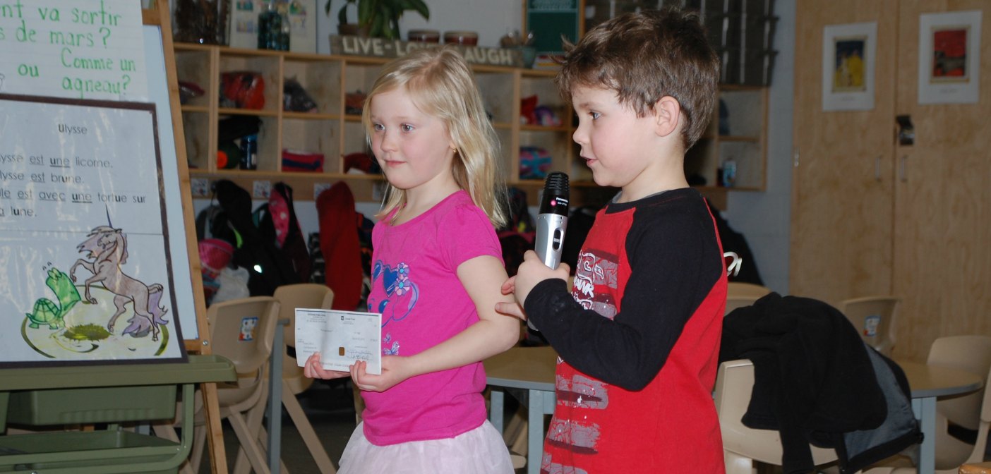 Students Claudia Kruger and Wyatt Worne present a cheque to the OSPCA