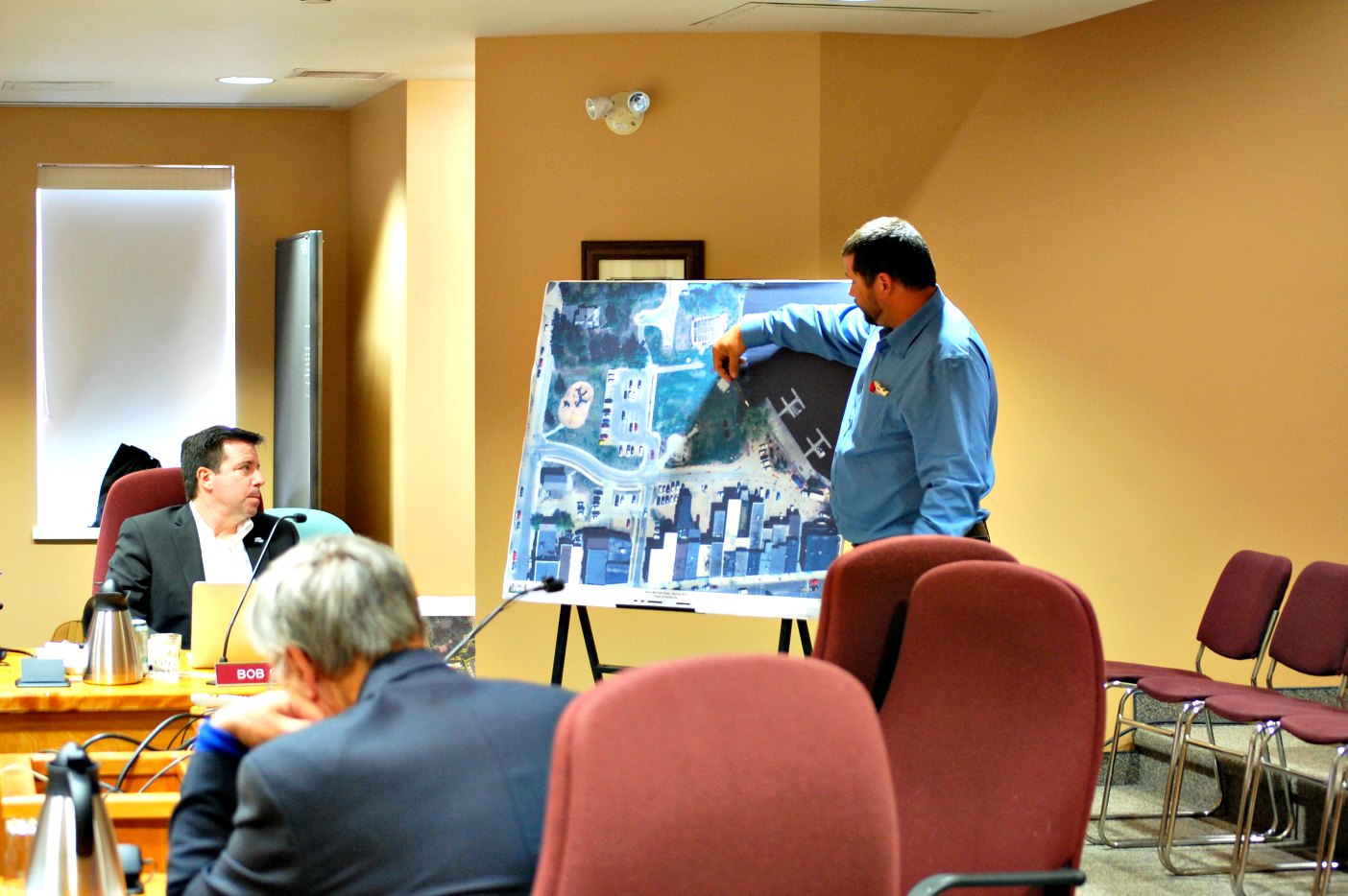 Brandon Hall explains drainage improvements in River Mill Park to Council