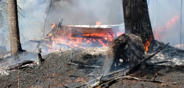 Brush fire contained by local crews yesterday