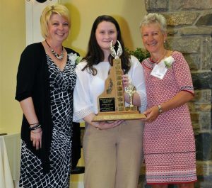 Janet Markham and Rose Evans receive the Jan Glenn award from Jan's granddaughter