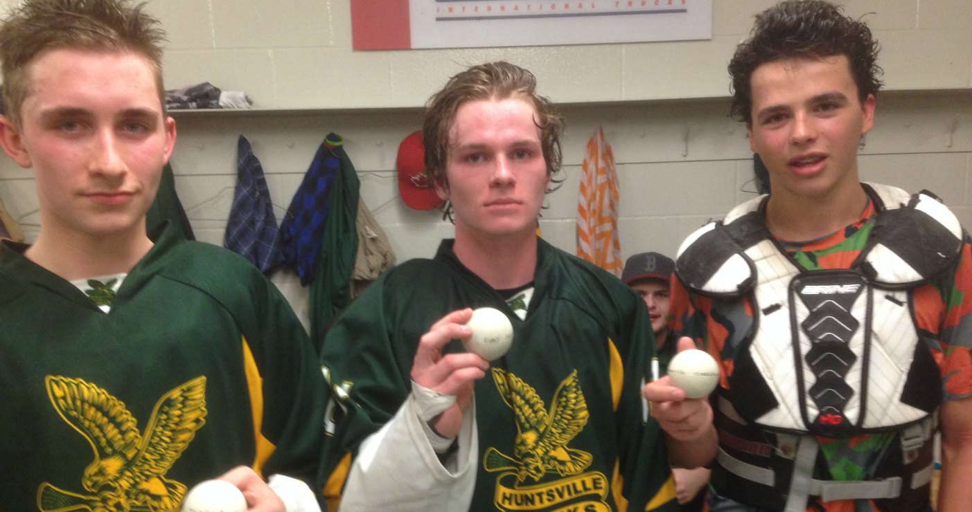 Peter Hrynuik, Dalton Boothby and Nick Van Gelder celebrate their first goals as Jr C Hawks