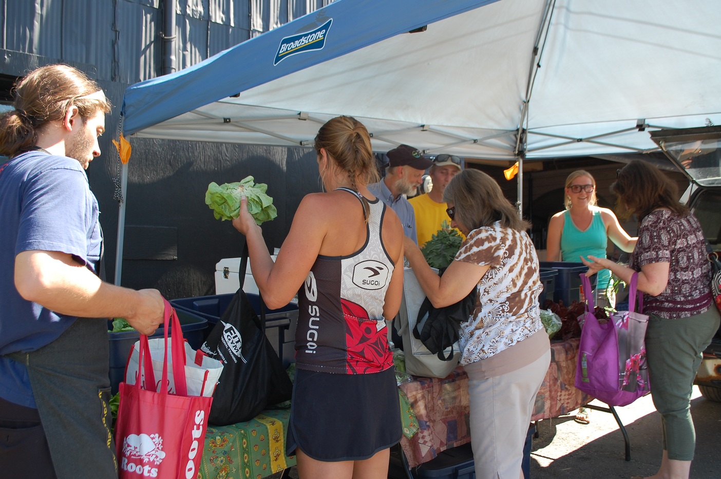 Eat Local Muskoka members pick up their weekly food boxes behind The Great Vine