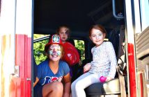 (From left) Allexis, Lily and Zoe Caughey in the ladder truck