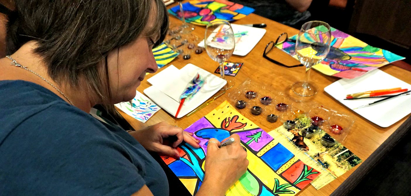 Angie Jeans creates a rendition of a moose in the style of Romero Britto