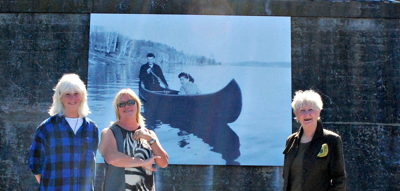 (From left) Suzanne Riverin, Diane Thoms and Kareen Burns in front of the new swing bridge mural