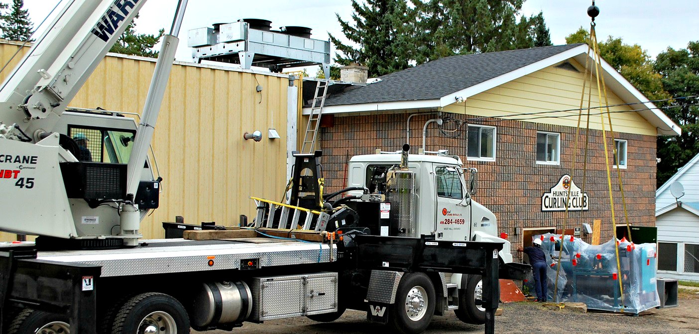 Huntsville Curling Club’s new ice package is moved into the building. The new condenser is visible on the roof. Photo: Dawn Huddlestone