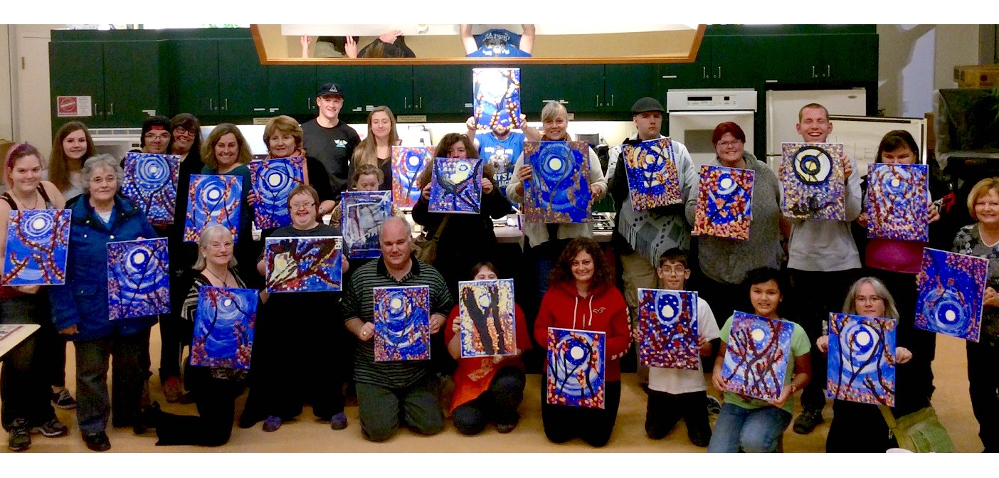 Participants in the first Creative Community Muskoka art class show off their vibrant paintings (Photo: Andrea Johnston)