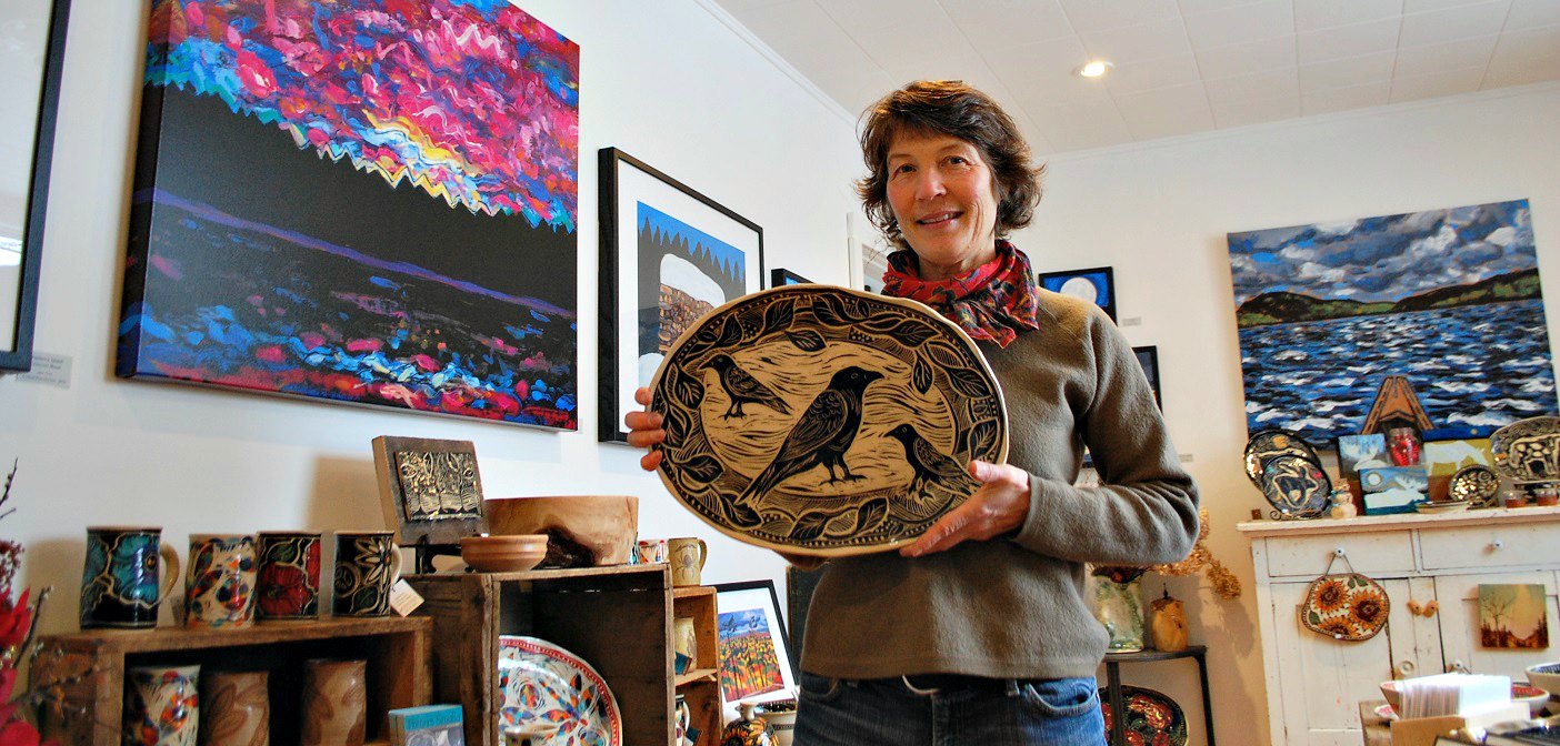 Karen Gray holds one of her favourite sgraffito platters in The Potter’s Studio and Gallery