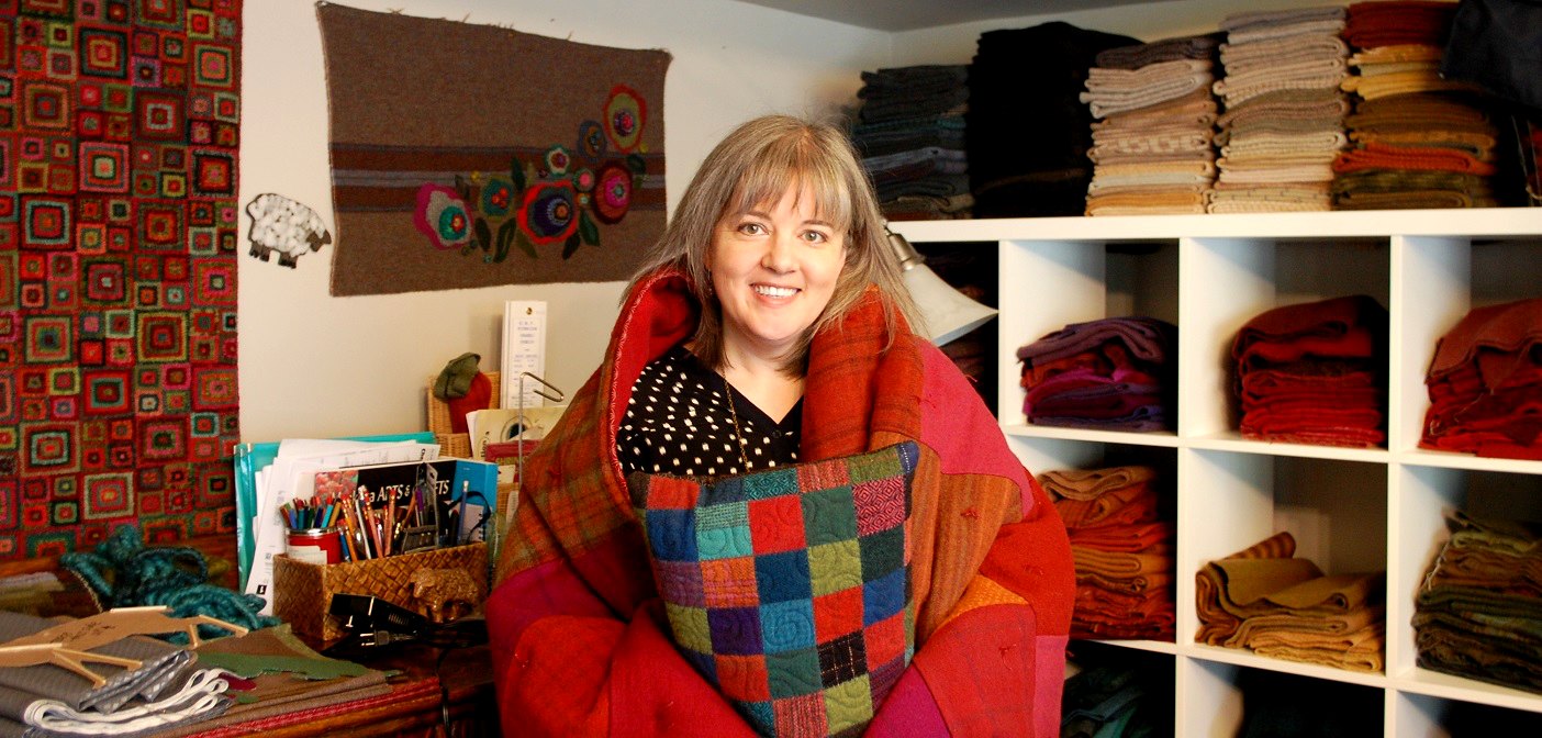 Fibre artist Jen Manuell cozies up to some of her creations