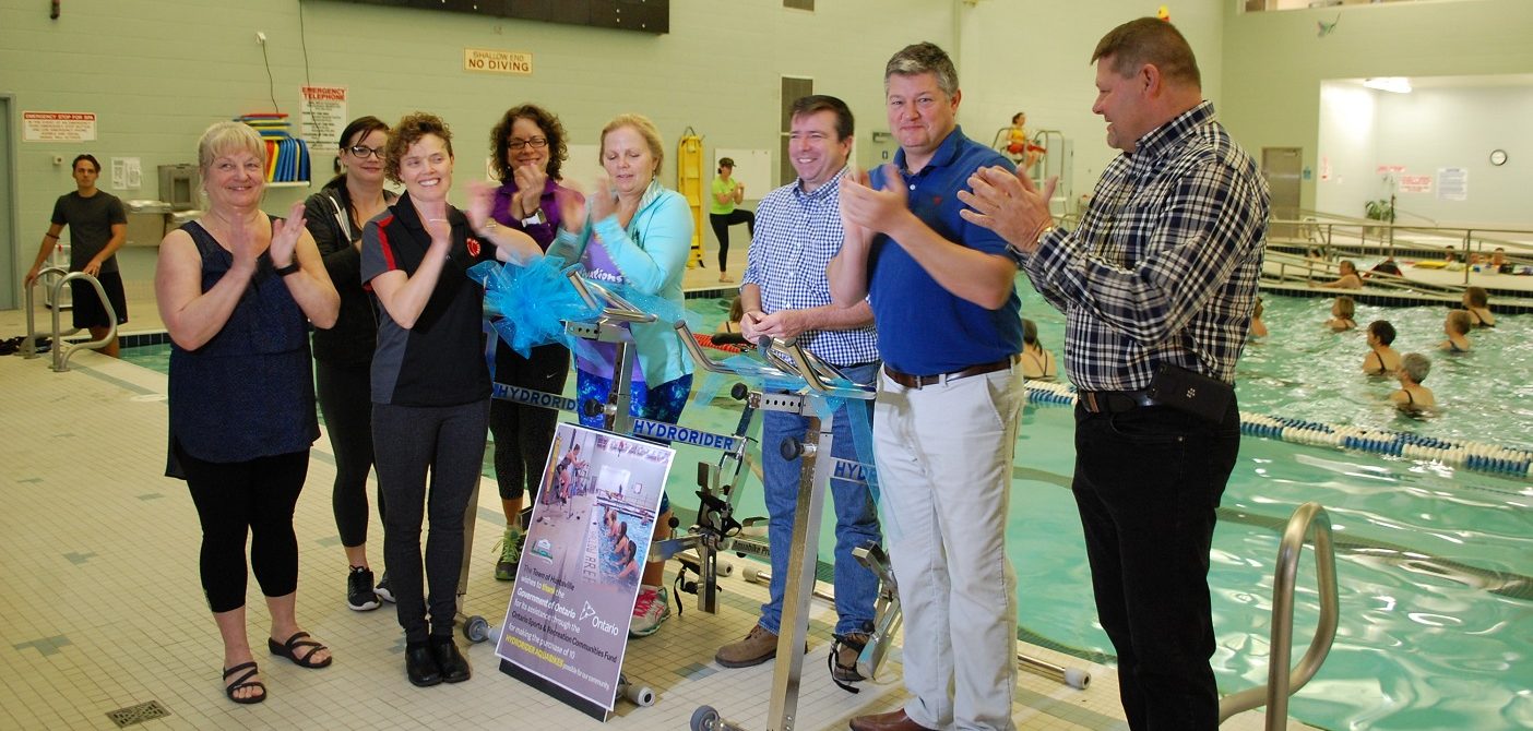 Councillor Bob Stone (third from right) cuts the ribbon to officially open Huntsville Sports and Recreation Week