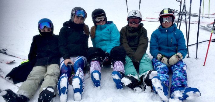 Members of the HHS Alpine ski team (from left) Jacob Hall, Emily Jason, Sydney Stevens, Cole Stevens, and Emma Magee take a break from the race (Photo: Tara Schmidtke)