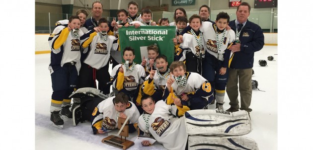 Play as a team, win as a team! Pee Wee Rep Otters take regional Silver Stick