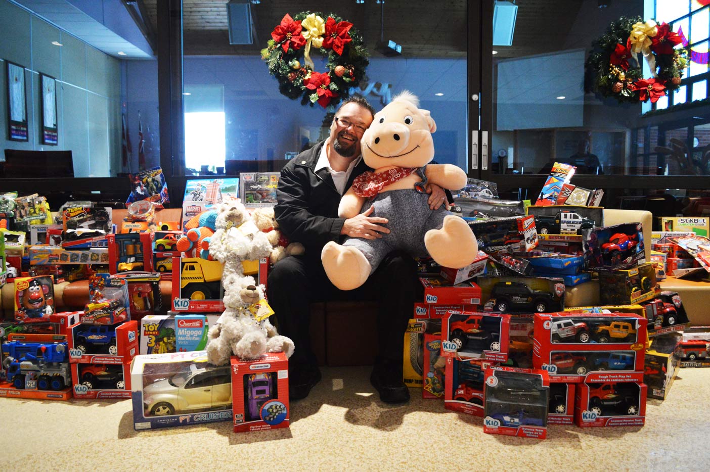 Major Darren Wiseman surrounded by a fraction of this year’s donated toys.