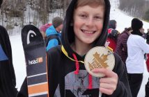 Kyle Mattice shows off one of two medals he earned in the double-header (Photo by Alex Spiers)