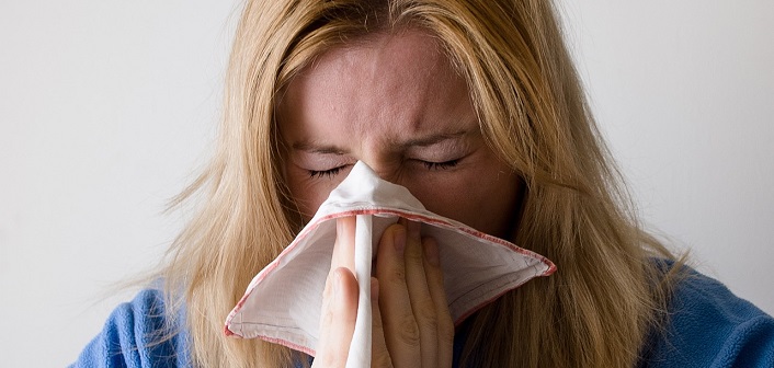 Woman sneezing