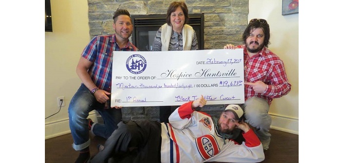 Brent Ellerson (left), Mike Shaver (front) and Jamie Clark (right) present a cheque to Hospice Huntsville executive director Bev Lashbrook (submitted photo)