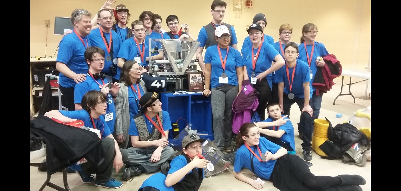 The Hoya Robotics team and mentors show off their hardware (Photo courtesy of Ian McTavish)