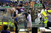 Members of the Hoya Robotics team (4152) carry their robot onto the playing field (Photo: Paula Boon)