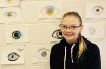 Emma Dickson eyes her class artwork