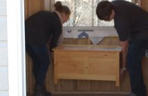 Elora Middleton and Byron Boothby place the time capsule inside the new swing bridge master's cabin