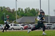 Hawks U11 Riley Reid races up the field playing midfield with his cousin Owen O'Halloran doing the same in background.