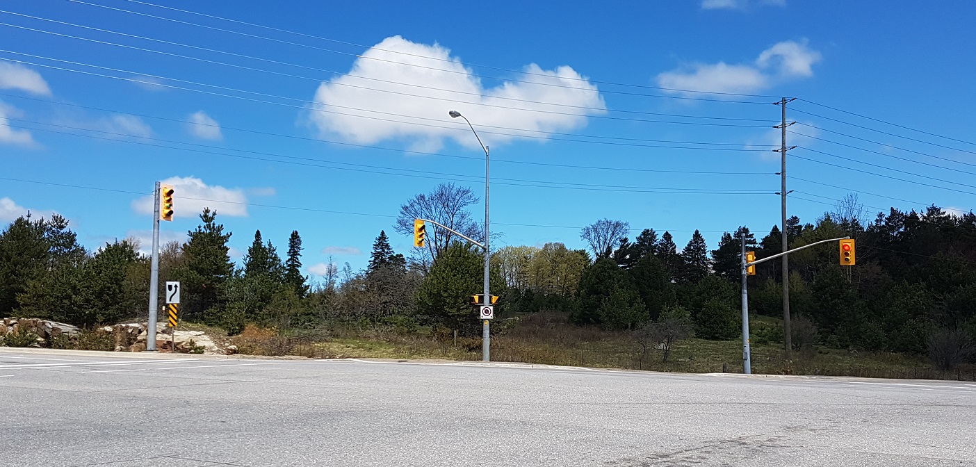 The proposed development would be between Hwy 60 and Golf Course Road where they intersect Earls Road. This view of the property is from Hwy 60.