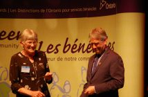 Dianne Leeder-McAughey receives an award from MPP Norm Miller for 15 years of service to the Huntsville District Memorial Hospital Auxiliary