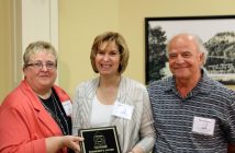 Wendy McConnell presents Bessie and Dino Georgas with the President's award.