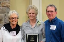 Dorothy Russell (middle) accepts the plaque posthumously on behalf of her husband David Russell, who was inducted as a 'Builder' from members Sandy Raven (l) and Barry Webb (r).