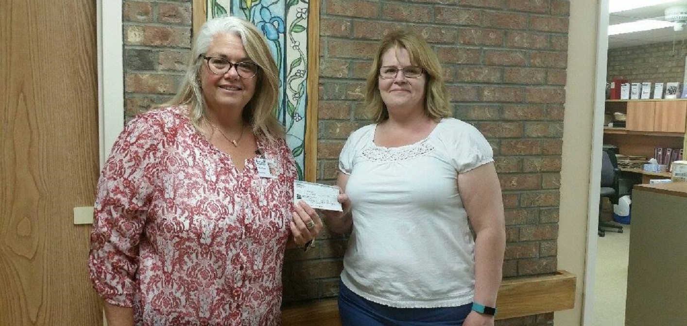 Lisa Wager presents a $500 cheque to Tracy Badger at Fairvern